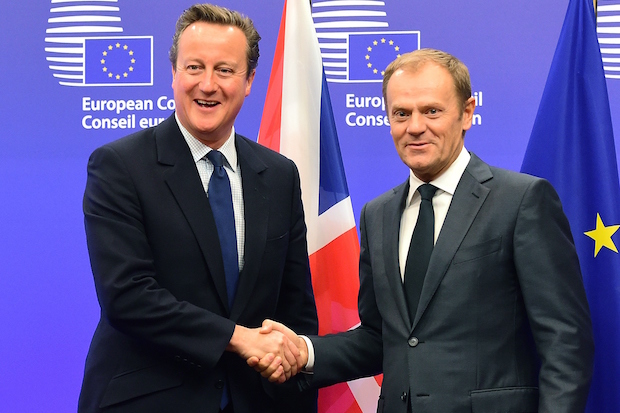 British Prime Minister David Cameron (L) shakes hands with European Council President Donald Tusk at the European Council in Brussels, on September 24, 2015. AFP PHOTO/EMMANUEL DUNAND (Photo credit should read EMMANUEL DUNAND/AFP/Getty Images)
